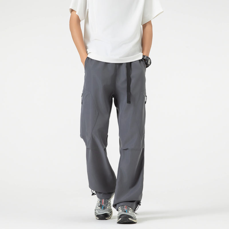 Calças de trabalho ao ar livre com design emendado estilo americano, calças compridas masculinas, calças largas soltas, calças esportivas casuais de perna reta